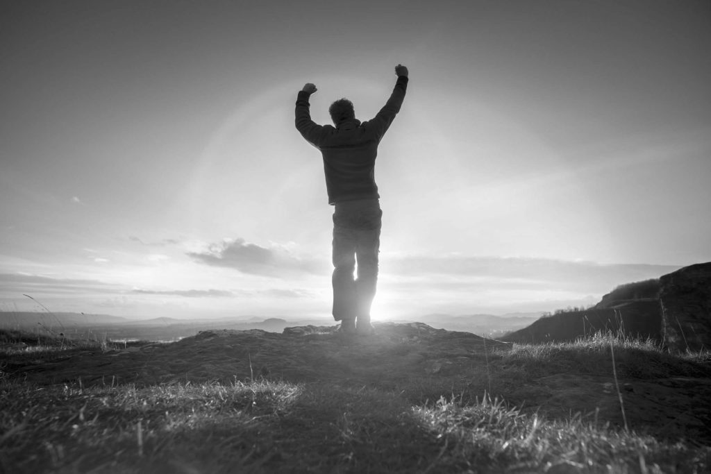 man on mountain top repenting of sins