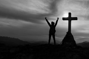 spiritual warfare cross on top of mountain