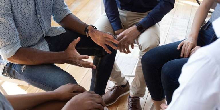 group of men participating in a small group, holding each other accountable