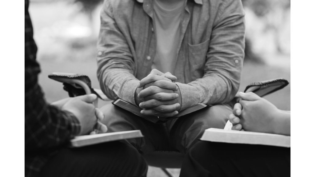 group of men gathered together studying the Bible, Spiritual Disciplines concept