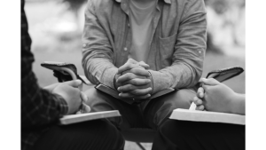 group of men gathered together studying the Bible, Spiritual Disciplines concept