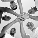 group of diverse guys with hands in - Discover key Bible verses that reveal the vital role of community in spiritual life, offering guidance for fostering strong, supportive bonds - supportive community concept