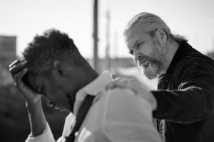 man trying to help another man, essence of evangelism concept